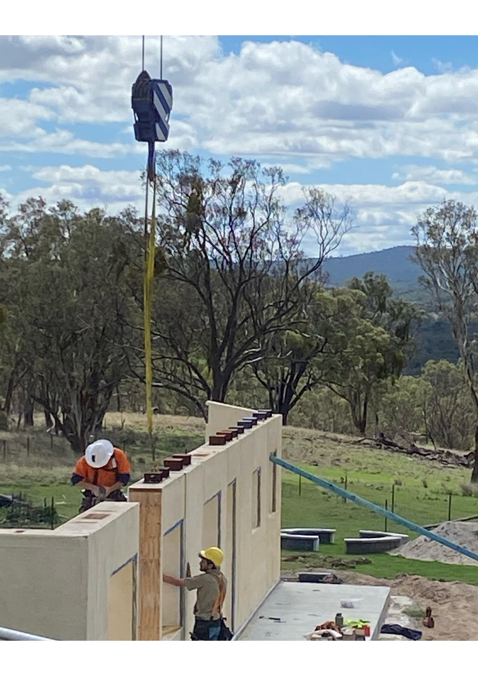 Crane lifting a Viva Panel into place on a rural Stanthorpe build