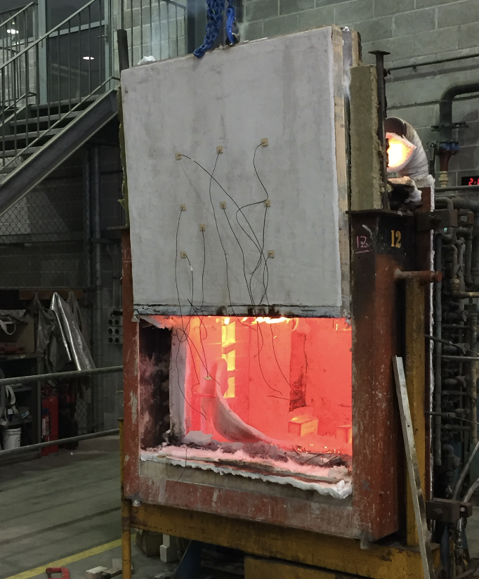 Straw panel fire test — panel intact next to furnace